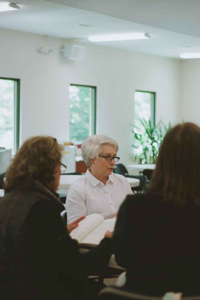 A group of women engaged in a Bible study session at a local church in Brevard, NC.